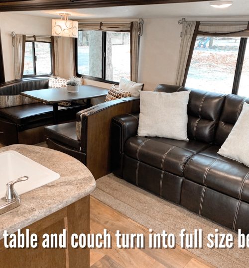 Interior couch and table turn into full sized bed for additional guests